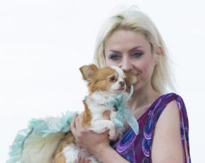 A model displays a dressed up pet dog